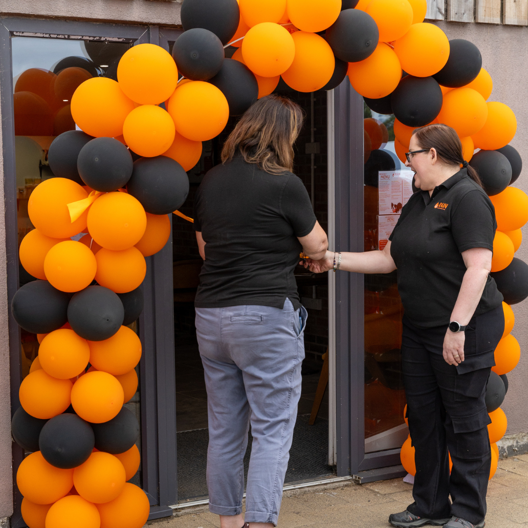 RAIN CEO Trish and Chair of Trustees Clare cutting the ribbon at the Misson, Doncaster centre opening in 2026.